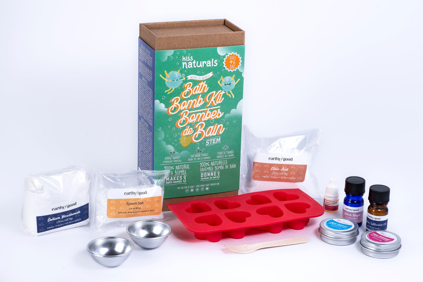 Bath Bomb Kit with various items including a red silicone mold, packaging, and ingredients on a white background.