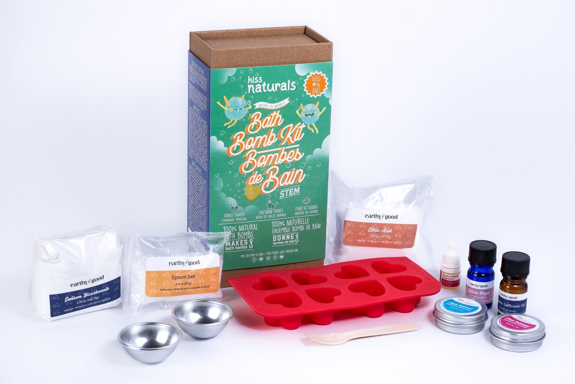 Bath Bomb Kit with various items including a red silicone mold, packaging, and ingredients on a white background.